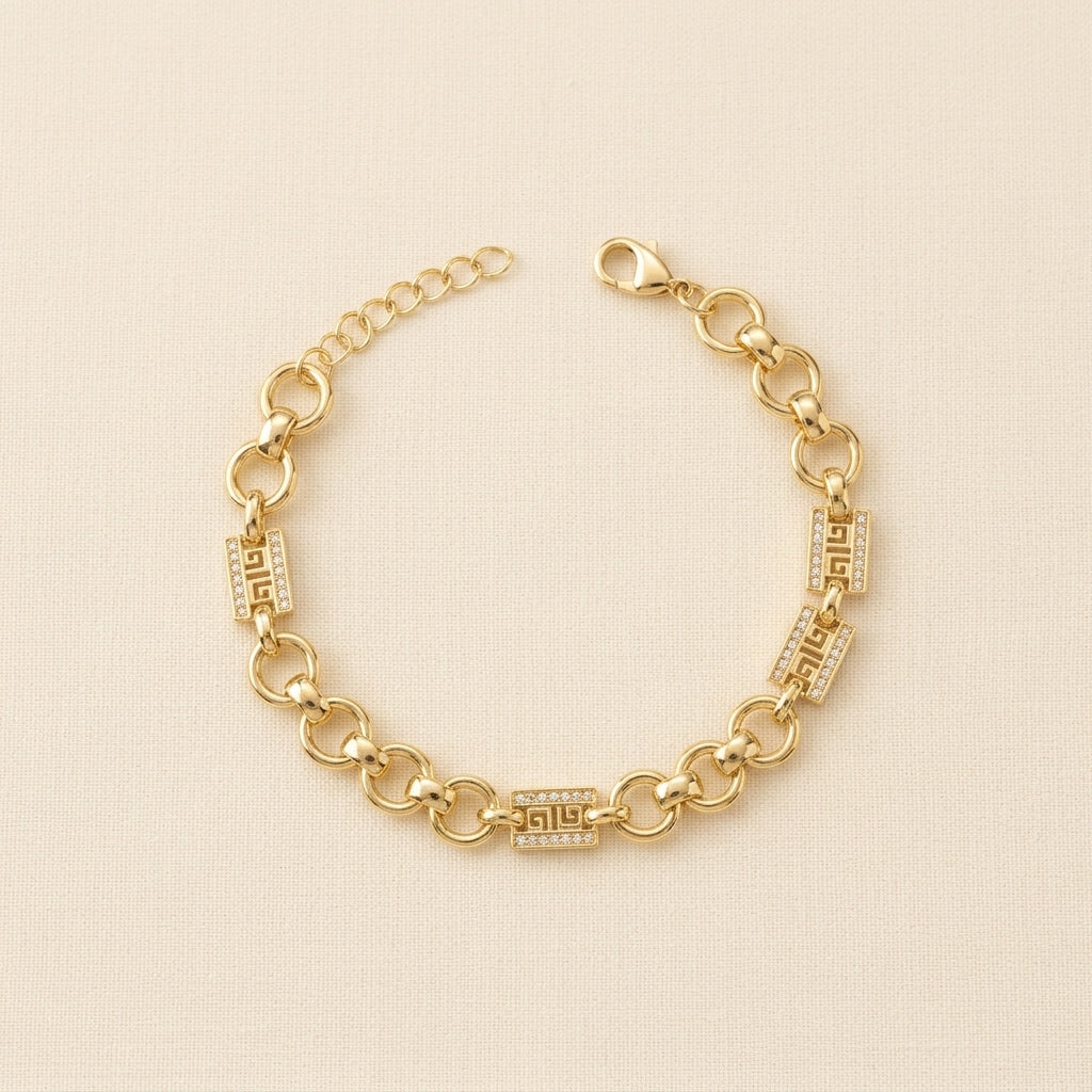 PULSERA ESLABONES CIRCULARES CON DETALLES DE GRECA GRIEGA Y CIRCONES PAVE