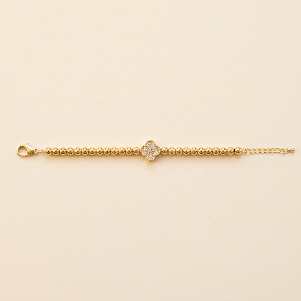 PULSERA DE ESFERAS DORADAS CON TREBOL CENTRAL Y CIRCONES PAVE