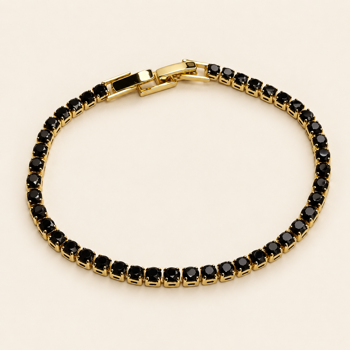 PULSERA TENNIS DORADA CON PIEDRAS NEGRAS